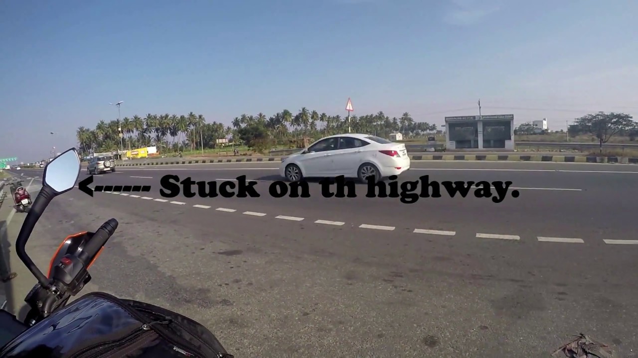 Biker helping stranded stranger on a highway - INDIA