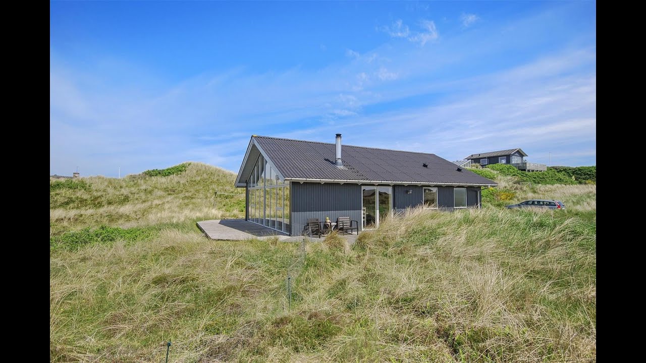 DanWest Ferienhaus 3138 in idyllischer Lage in die Dünen von Sondervig eingebettet