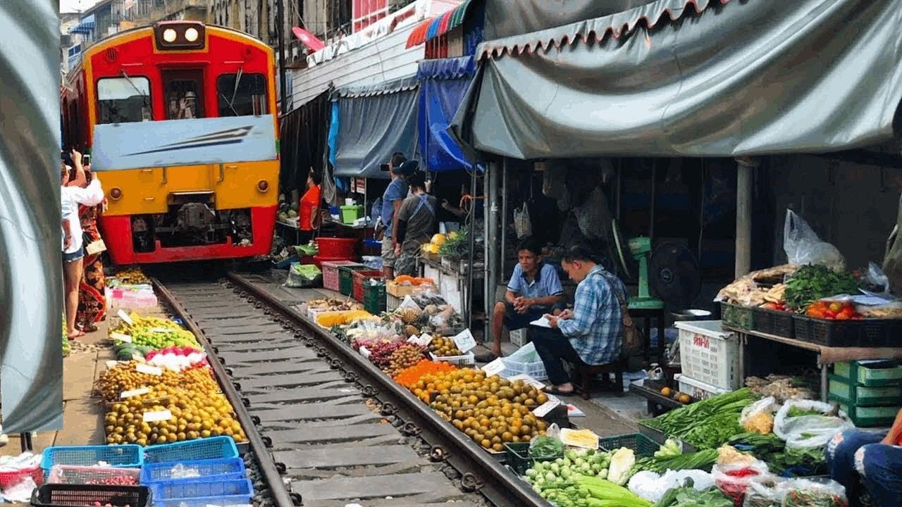 in between houses Cab ride train indonesia