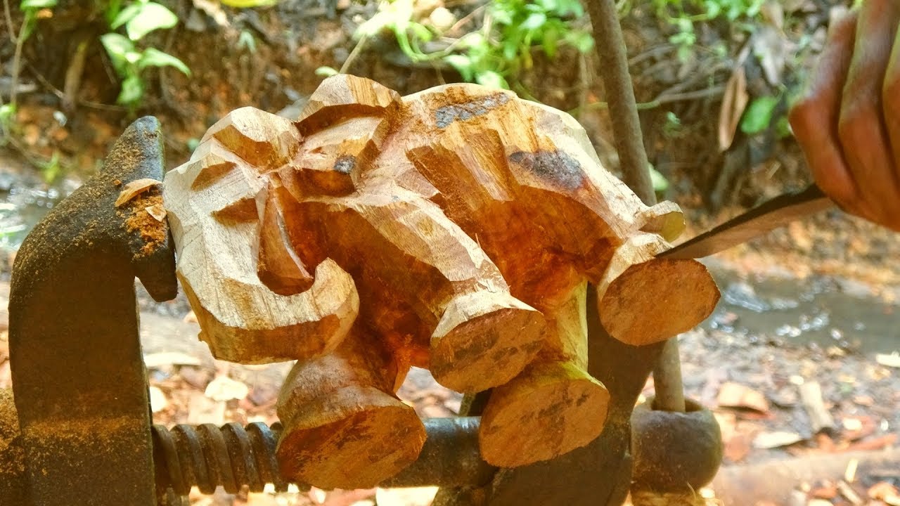 Life like wooden elephant in walking posture made by hand with real talent