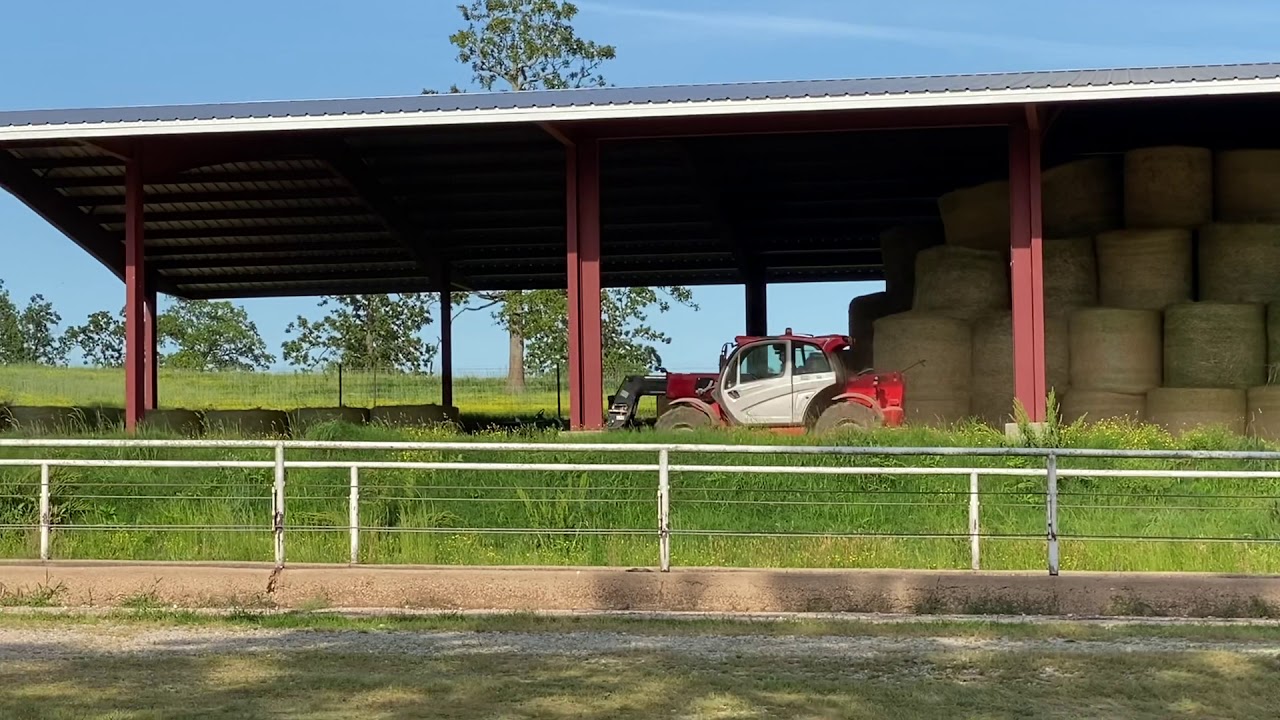 Stacking hay in the barn