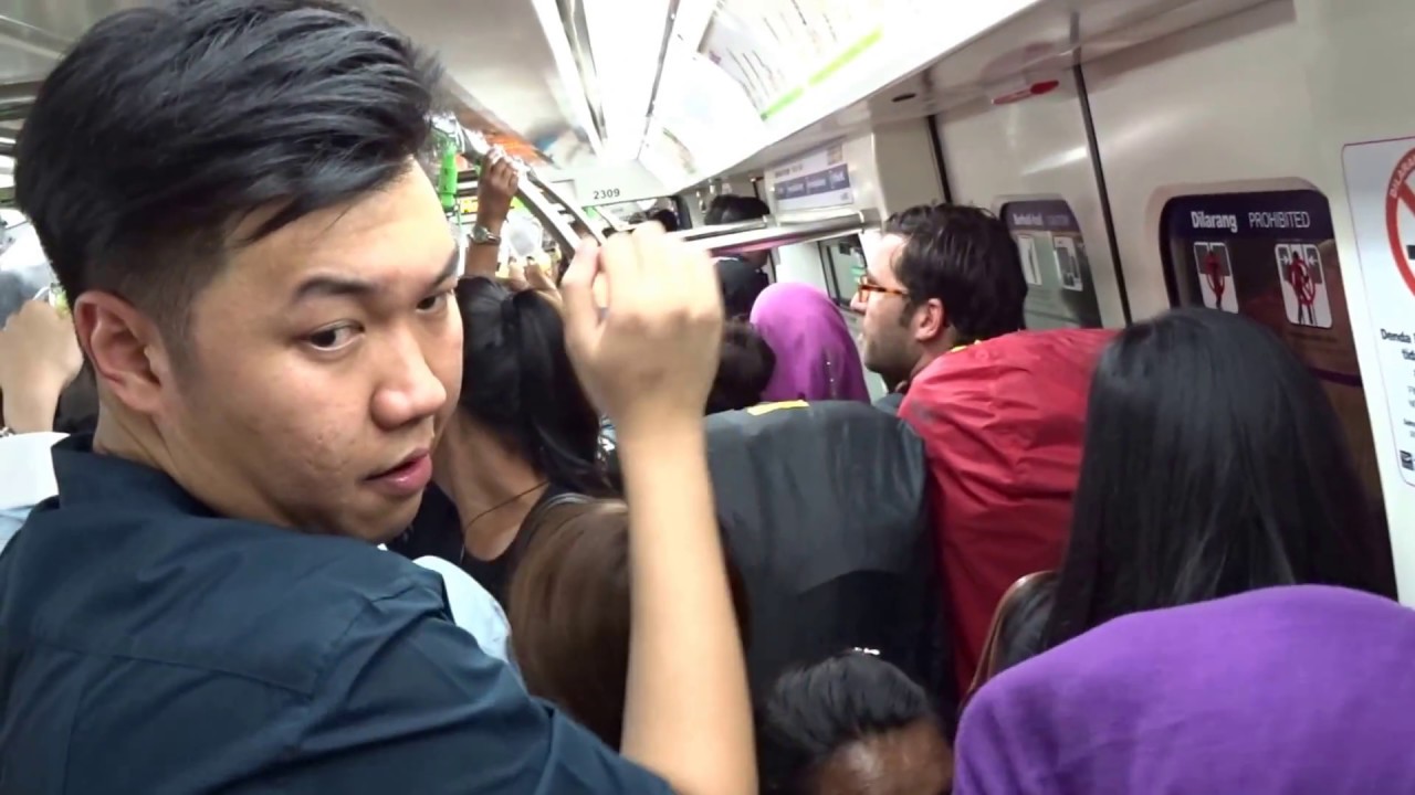 Ride a very crowded monorail in Kuala Lumpur, Malaysia
