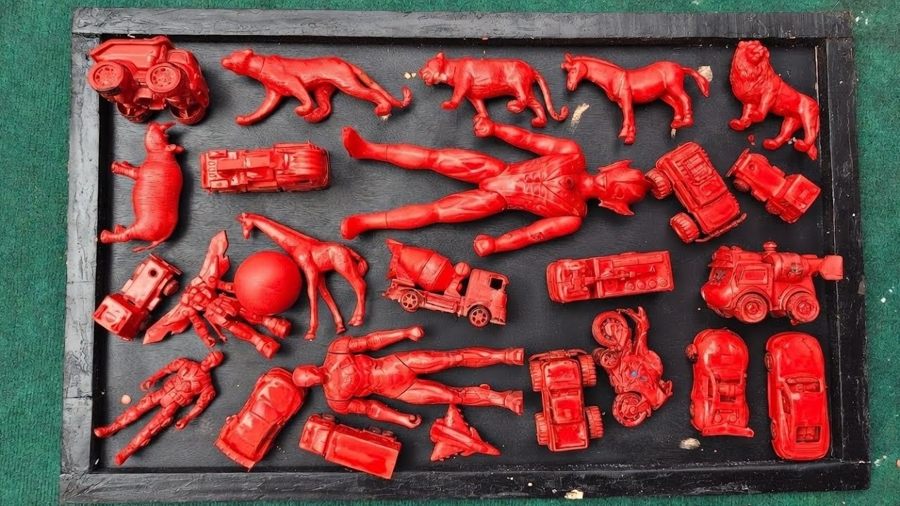 cleaning muddy toys, race cars, guns, boats, superheroes and wild animals and ironman