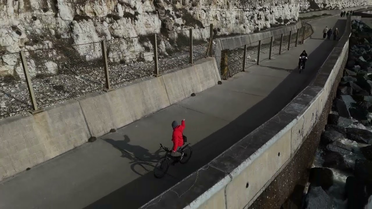 Active track with DJI mini 4 pro on bike ride on beach