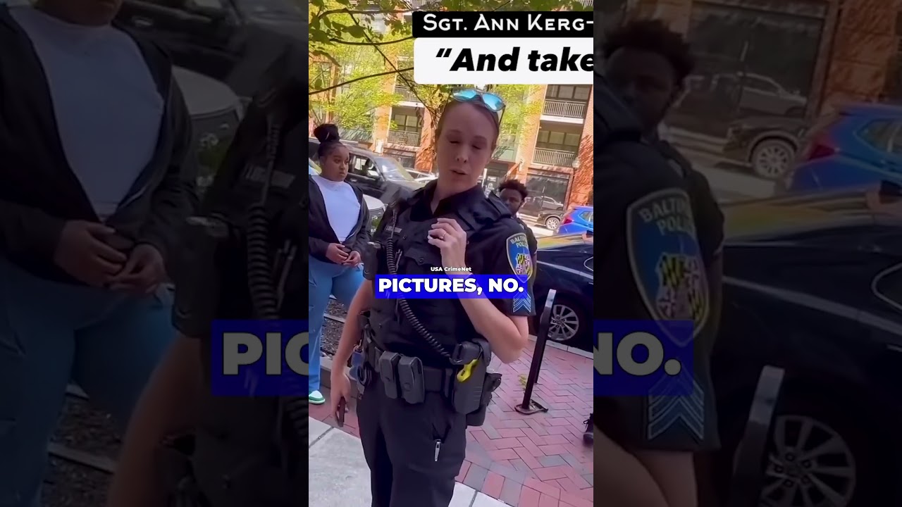 Женщина-полицейский против активиста за первую поправку на общественном тротуаре в Мэриленде