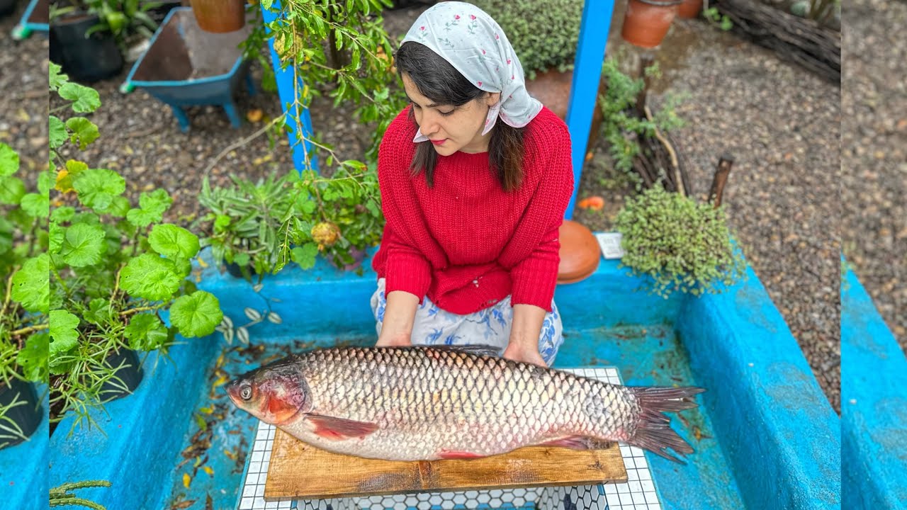 Cooking fish with organic vegetables and spices in a beautiful village
