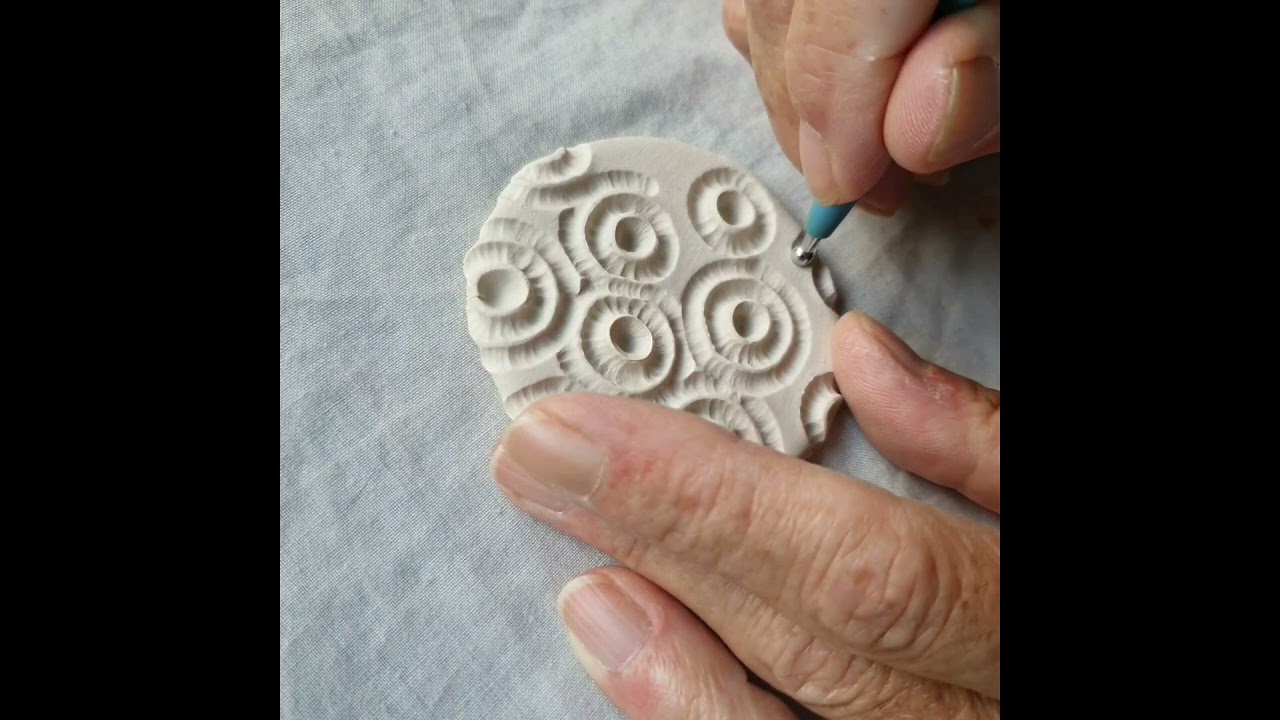Making a mini porcelain paperclay tile.