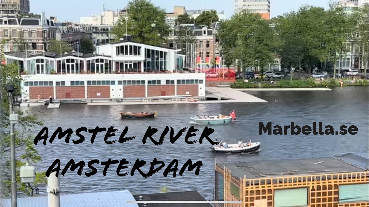 Relaxing Boats on Amstel River in Amsterdam