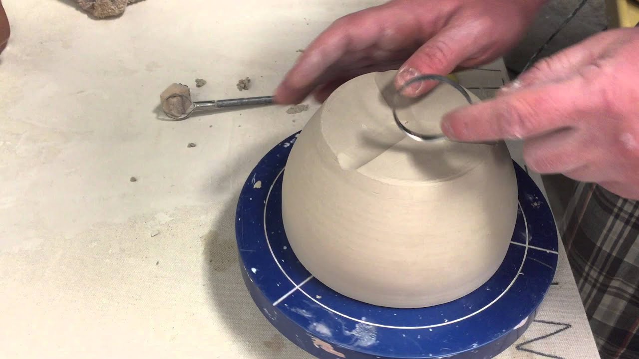 duke arts annex hand trimming a ceramic bowl