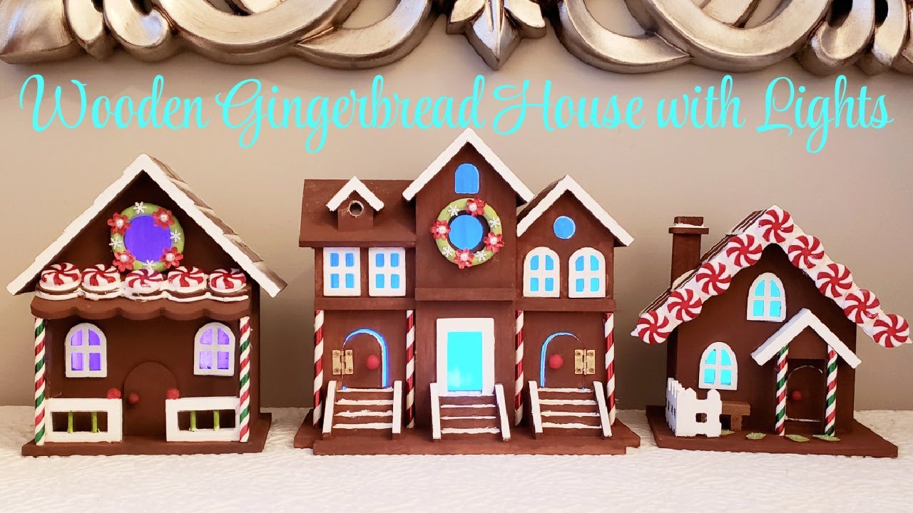 Wooden Gingerbread house with lights. Beautiful Christmas Gingerbread village