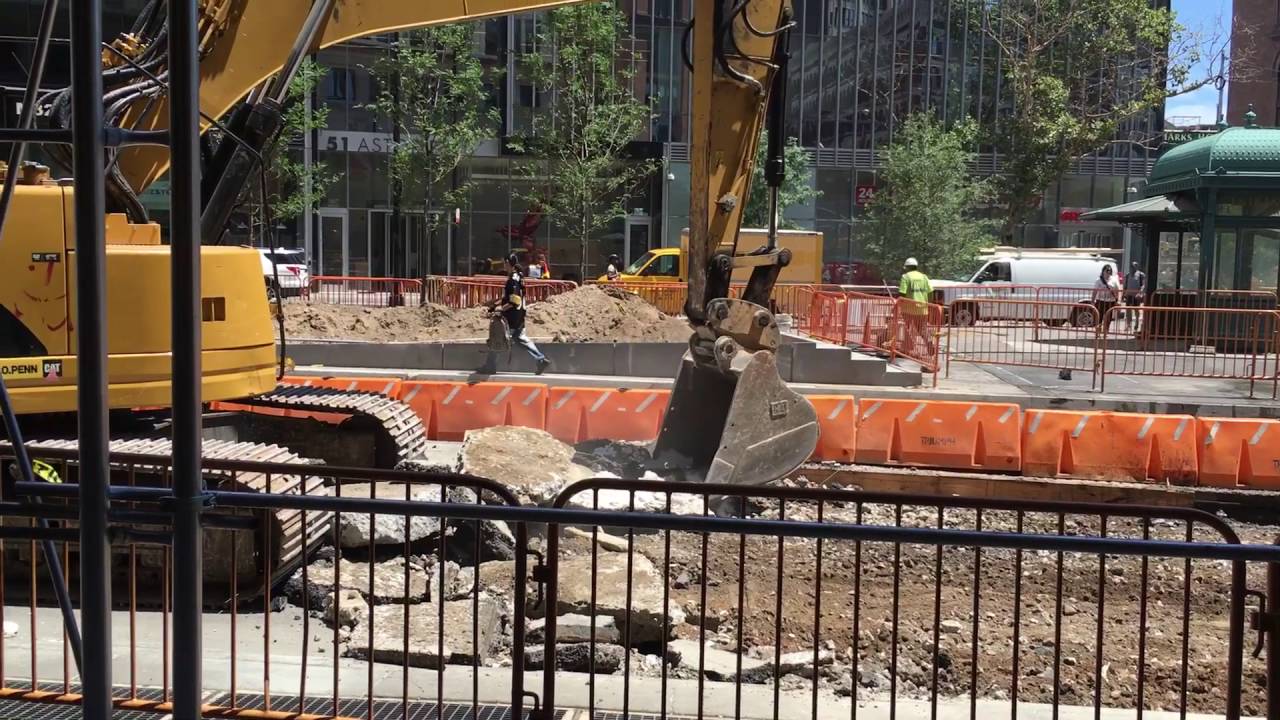 Great video of a Backhoe Truck ripping up road!