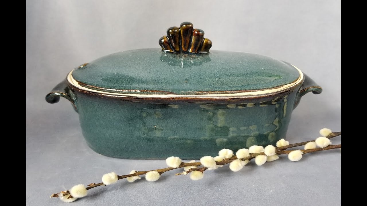 Making a Handmade ceramic covered oval baking dish on the pottery wheel with a slab bottom and lid.