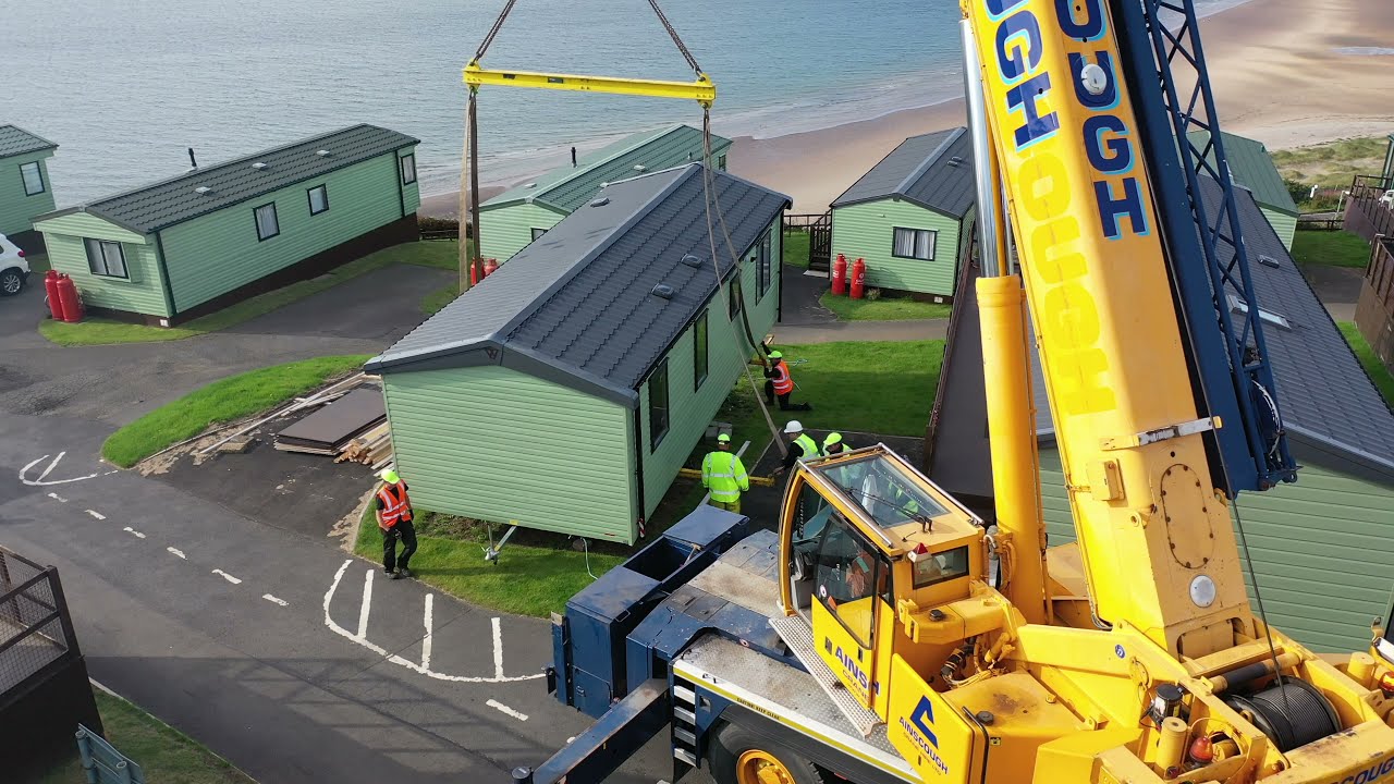 Pettycur Bay holiday home from transporter to pitch using a mobile crane