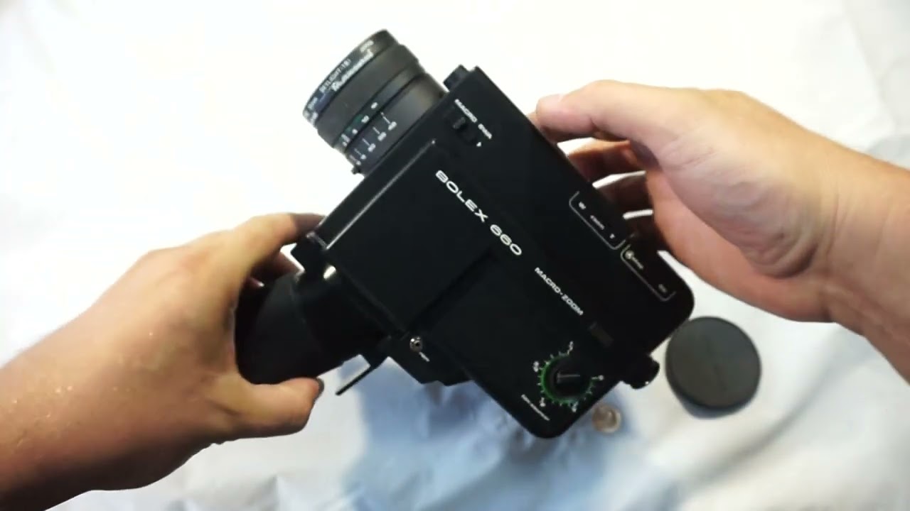 Bolex 660 loading Super 8 film and batteries on Super 8 camera Bolex 660 Macro-Zoom + ON SALE