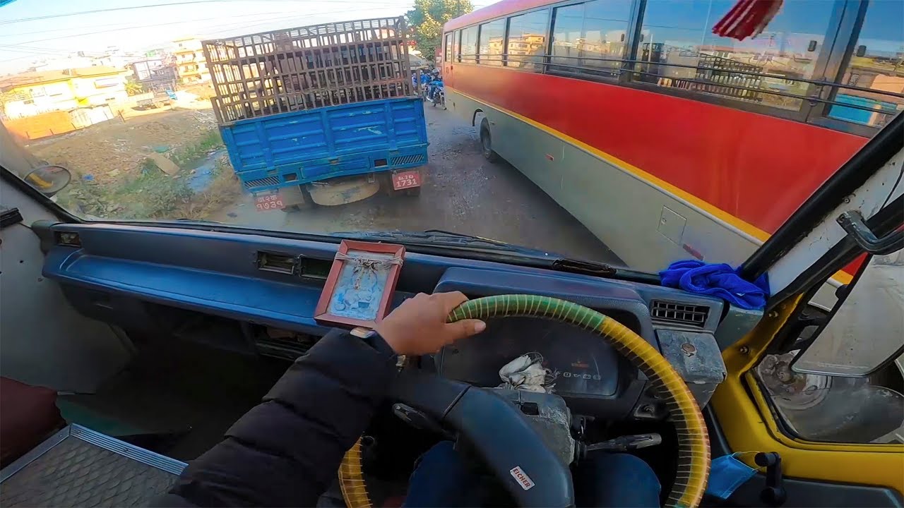 POV Bus Driving In City Narrow Road
