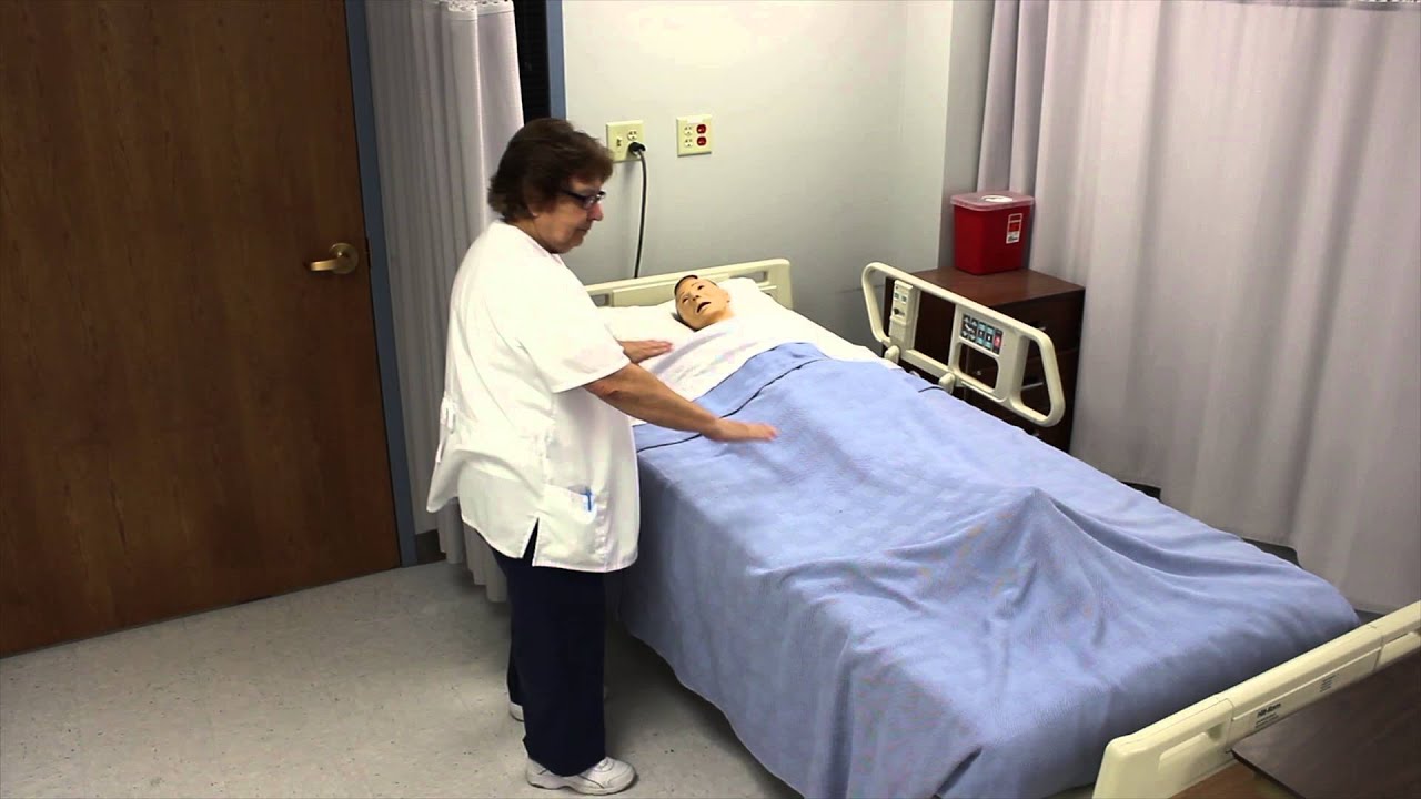 Moving a resident to the side of the bed