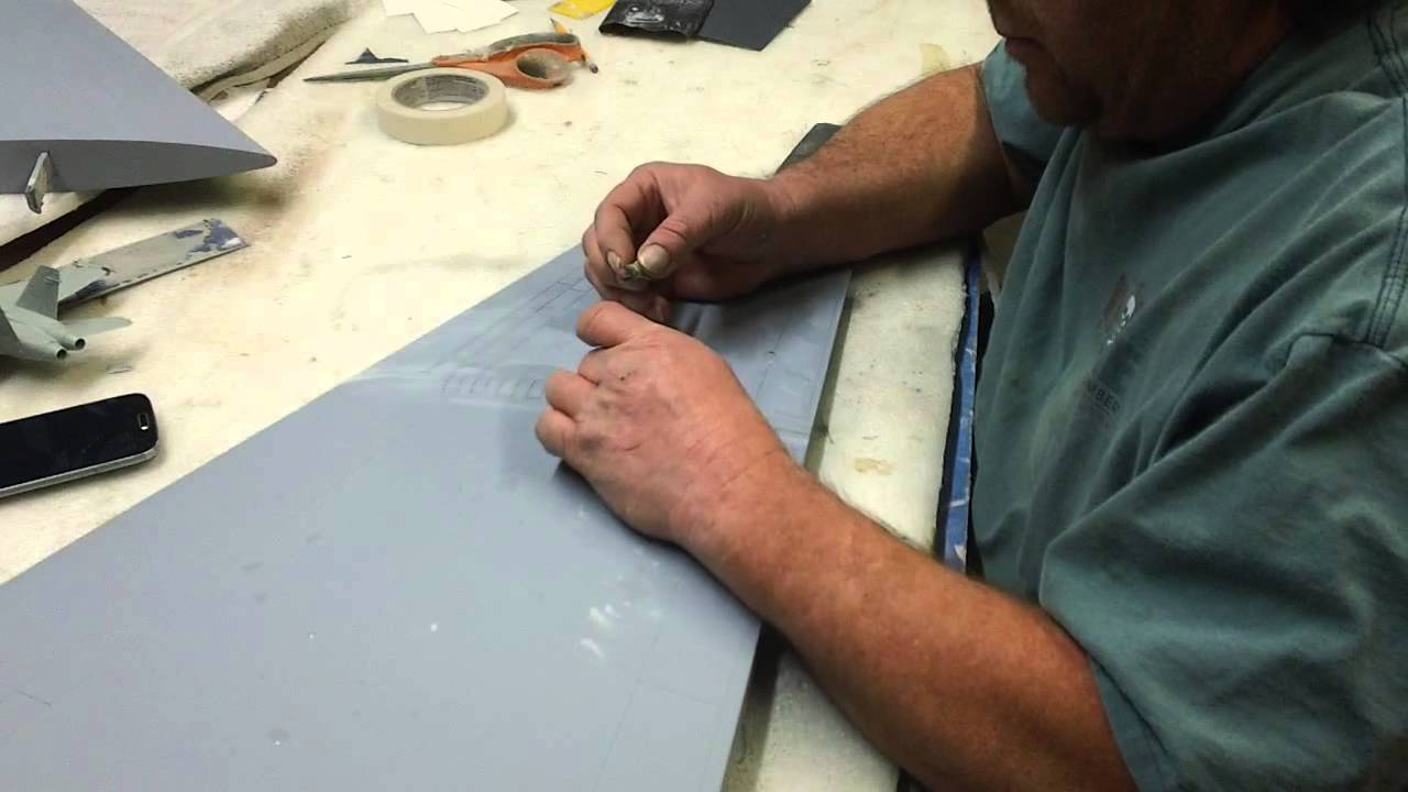 pulling graphic tape from panel lines