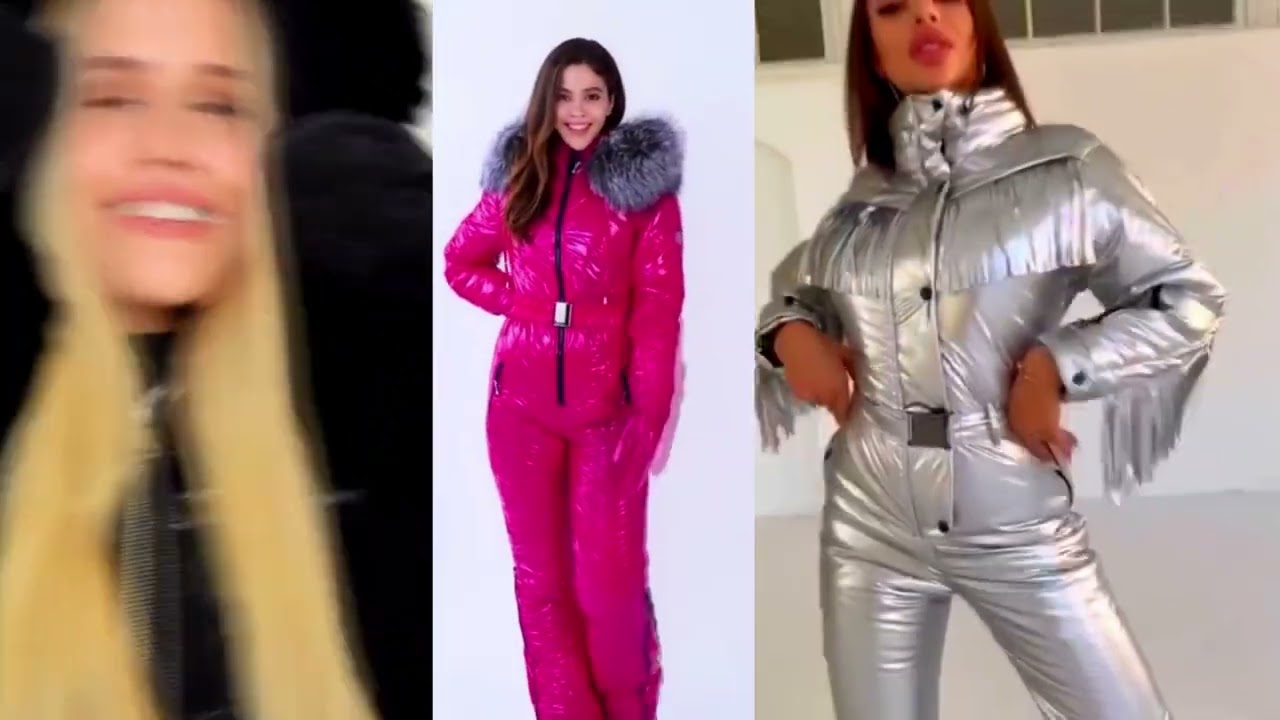 Beautiful winter ski overalls. Shiny warm women's winter overalls. Girls in puffer down overalls