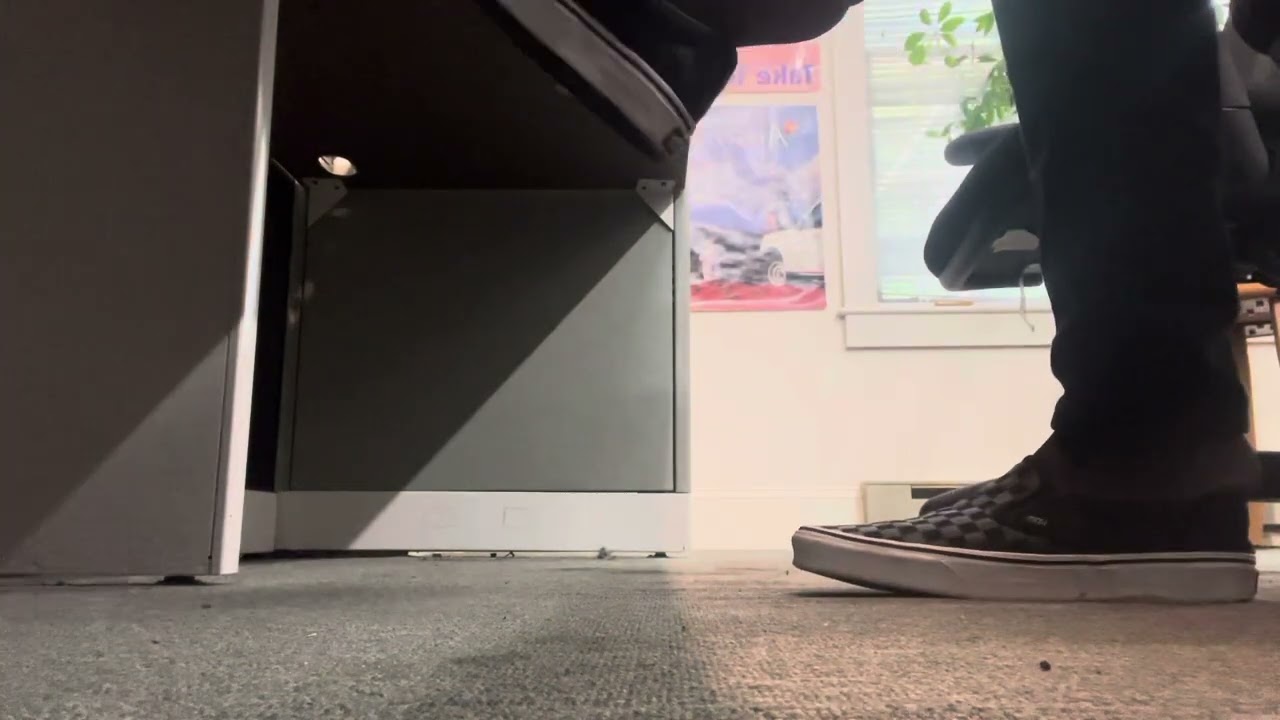 Exposed, ticklish nylon feet under the desk