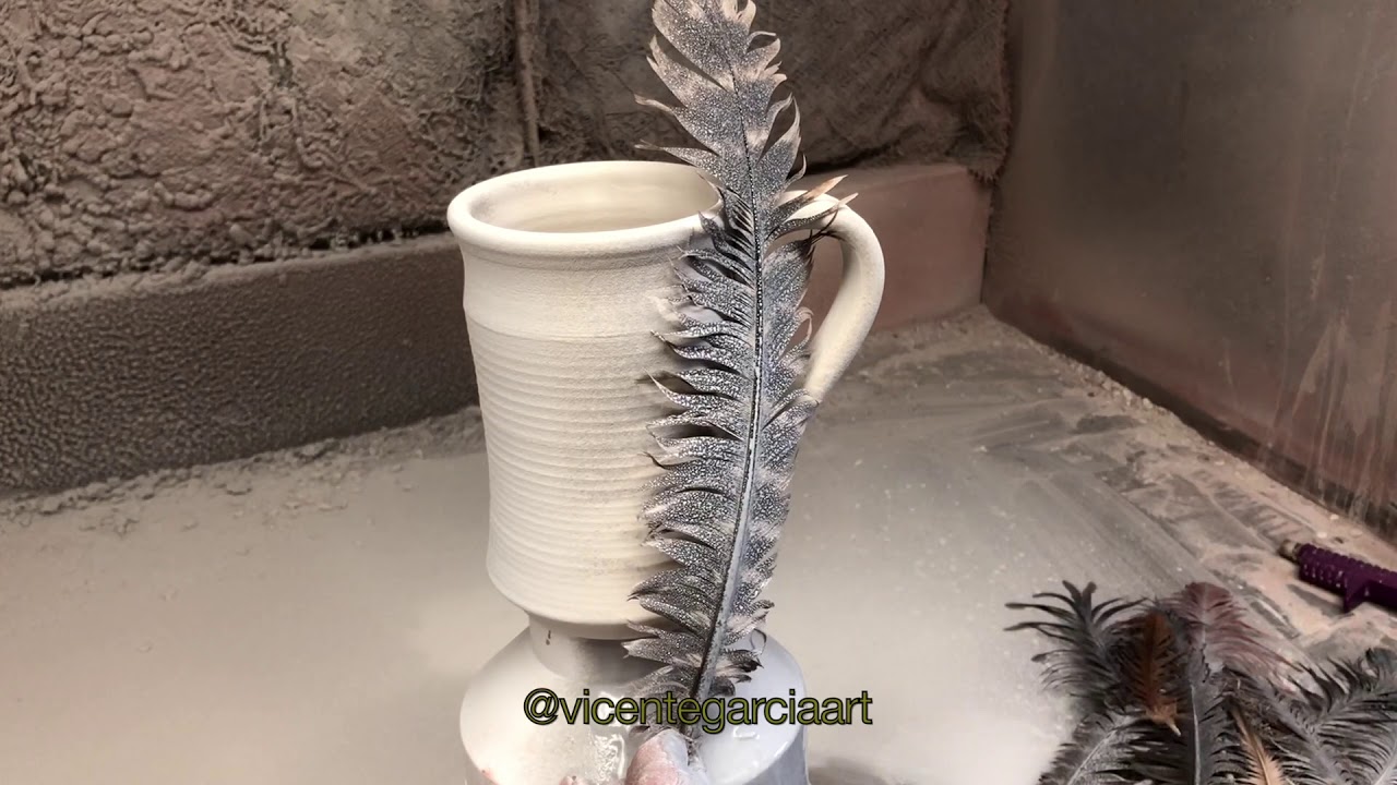 Mugs with feather designs