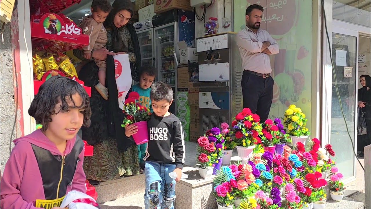 Shopping for the ancient holiday of Nowruz. Taybeh and the children at the market