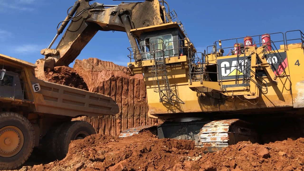 Huge Caterpillar 6040 Hydraulic Excavator Loading Hitachi EH3500 Dumpers