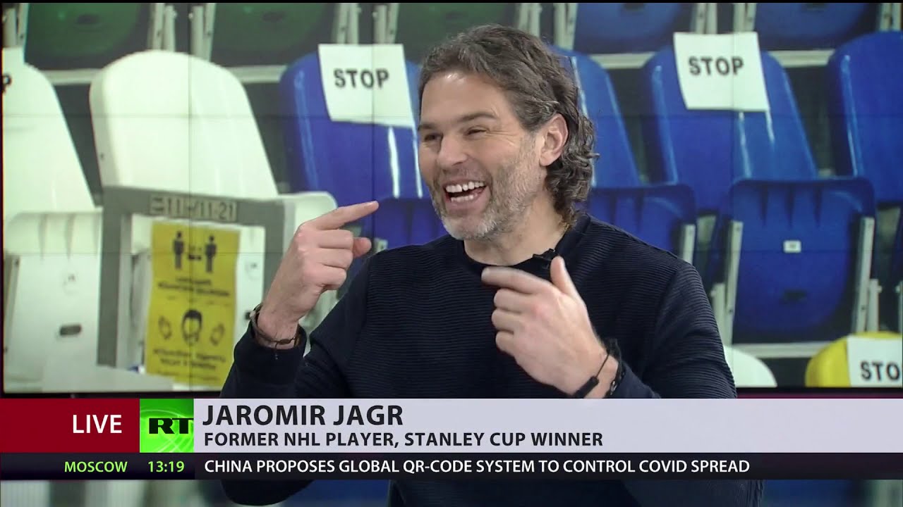 Neil Harvey interviewing hockey player Jaromir Jagr