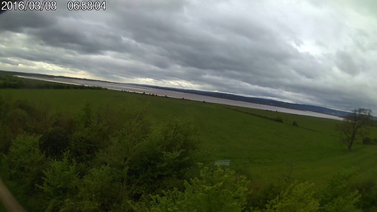 climbing the main mast on the Sharpness canal overlooking the River severn at Frampton upon Severn