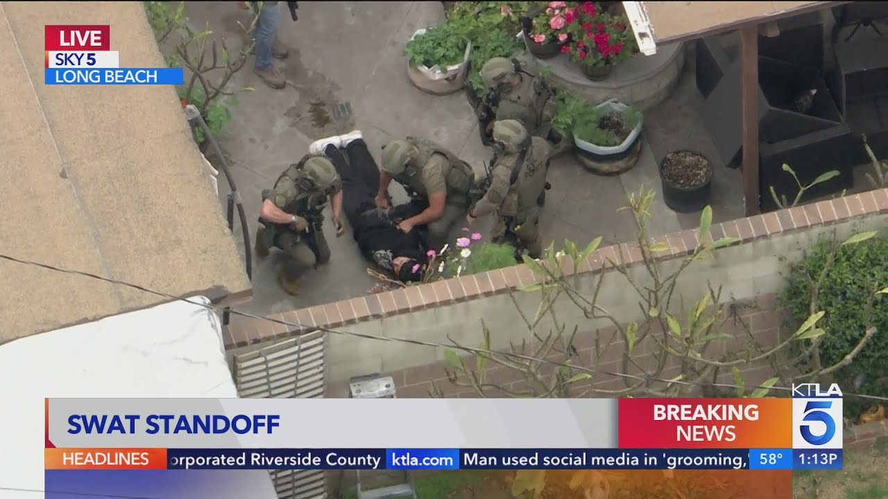 SWAT team engages in standoff with suspect in front of Long Beach home