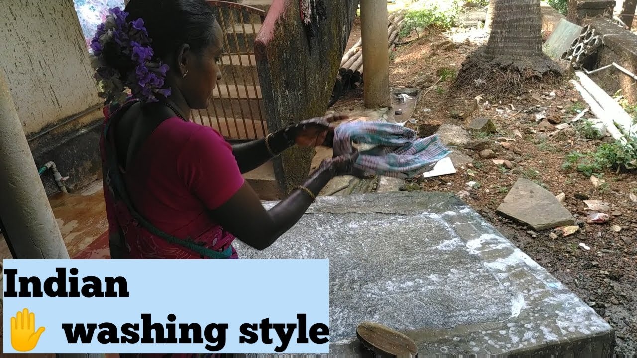 typical village style in India I washing clothes Indian style l washing clothes on a Stone I