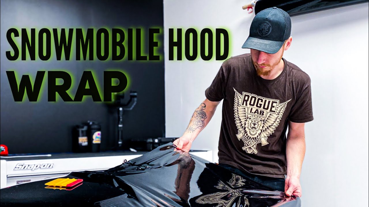 Vinyl wrapping snowmobile hood with vvivid vinyl . Part 1