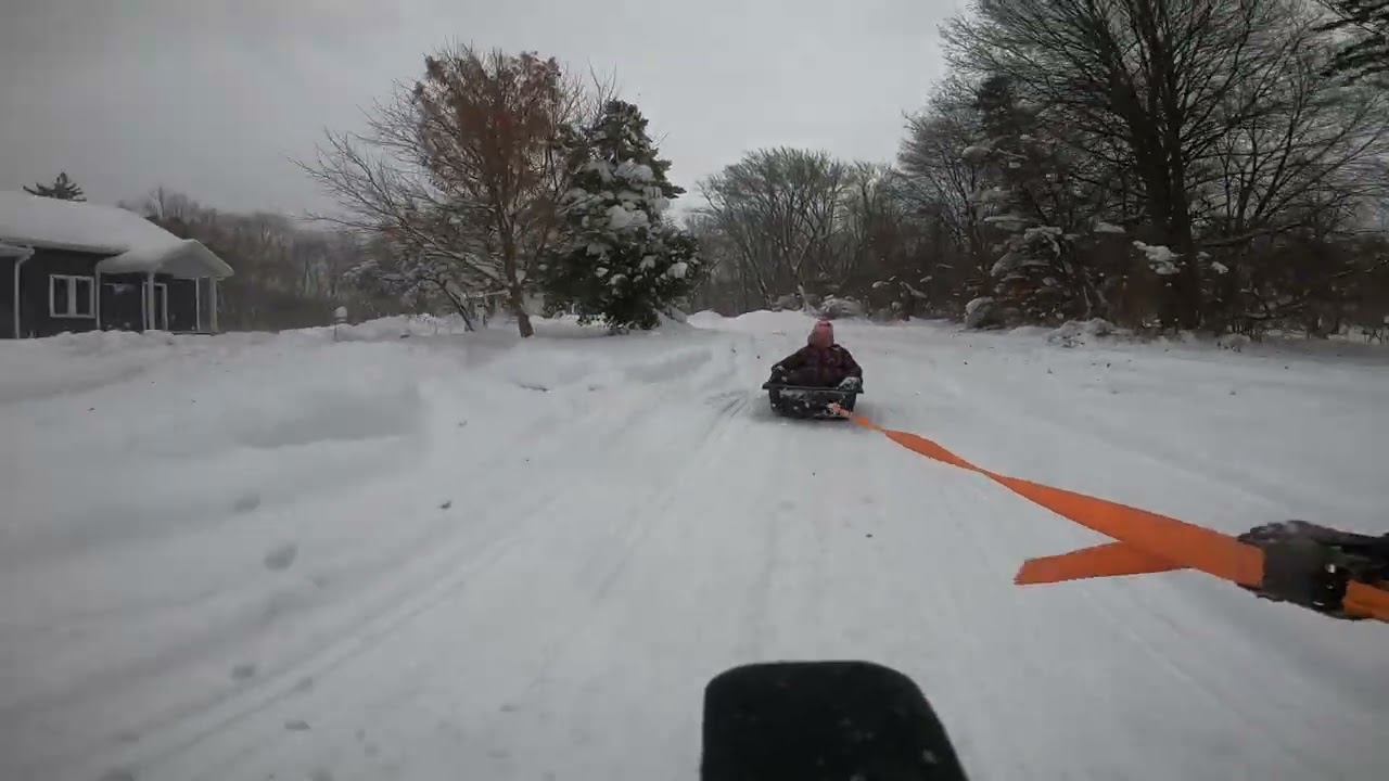 JOE AND EM PULLED INTHE SLED