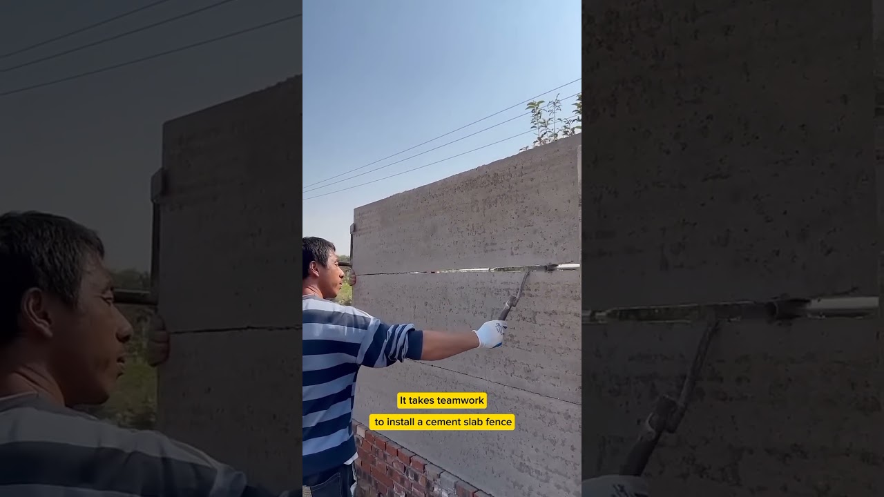 News contruction - It takes teamwork to install a cement slab fence