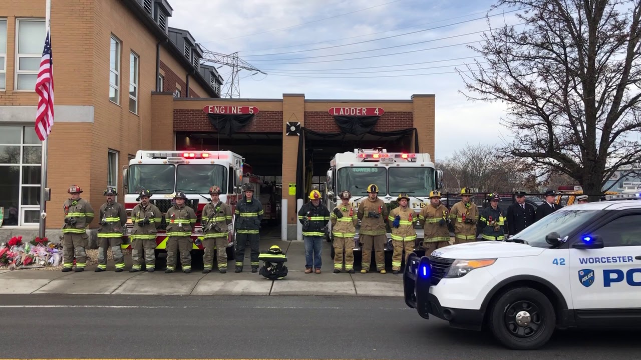 Firefighters stand at attention as funeral procession for Christopher Roy passes