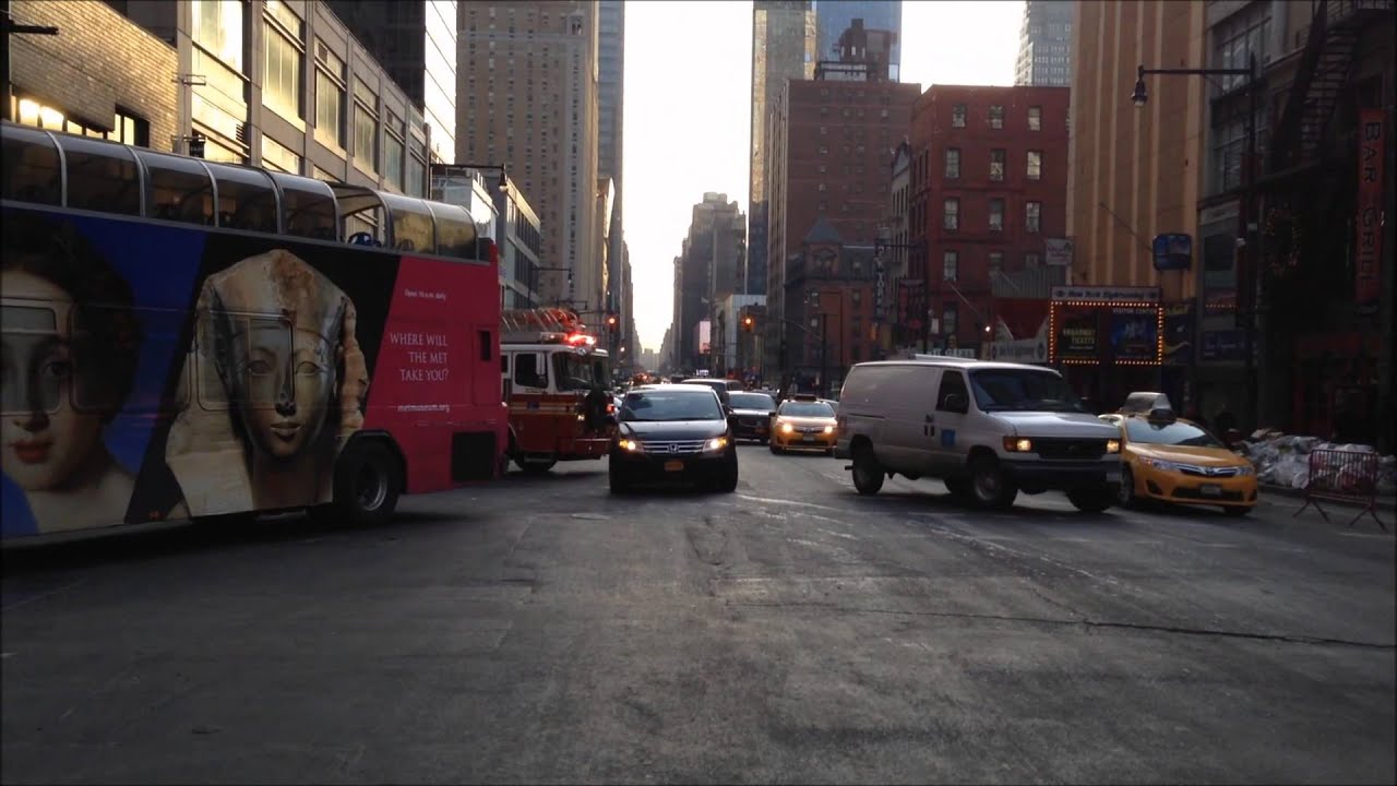 FDNY LADDER 4 RESPONDING FROM IT'S FIREHOUSE WITH BLAZING SIRENS & HORNS ON W. 48TH ST. IN NEW YORK.