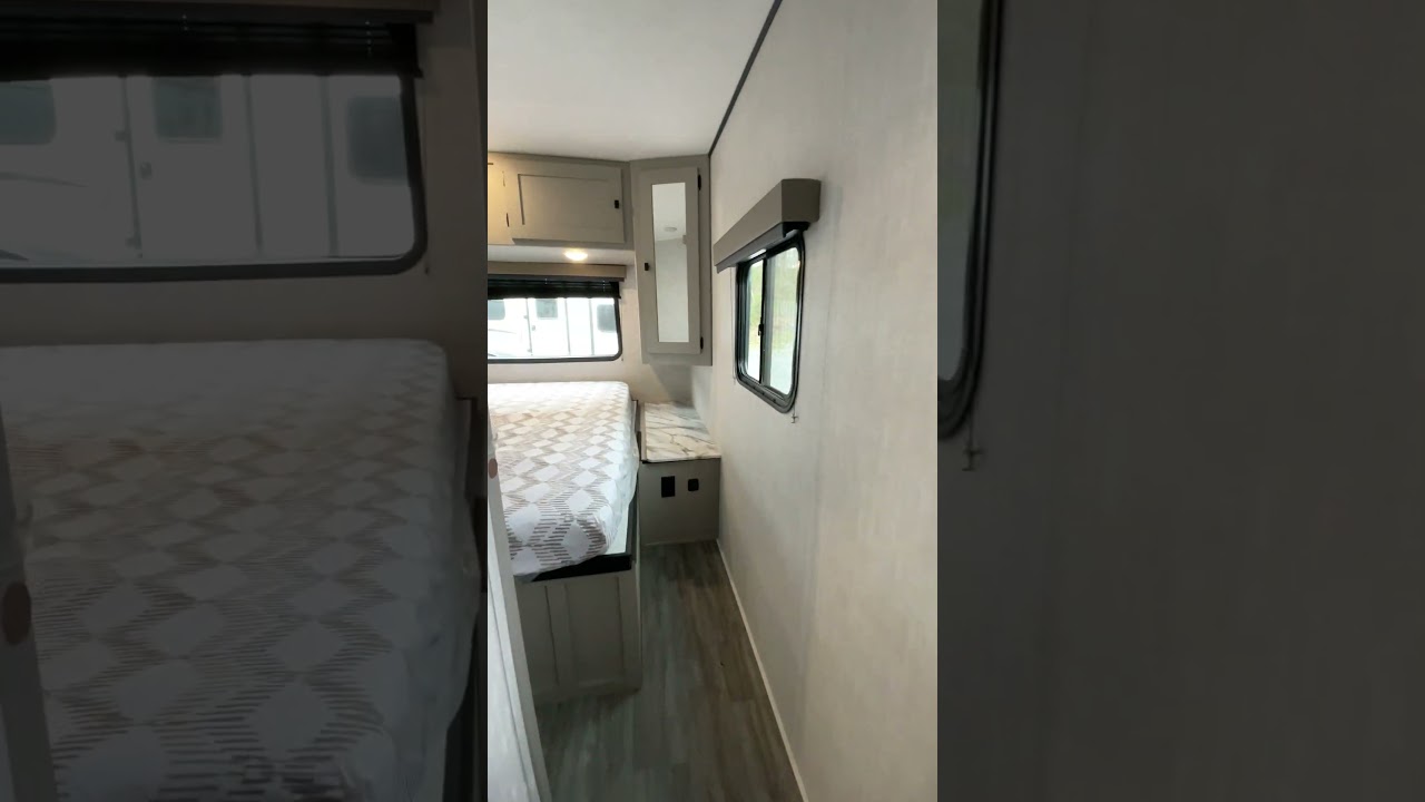This 30 ft. long trailer sleeps 8, has an outdoor kitchen, under-bunk storage, and more!