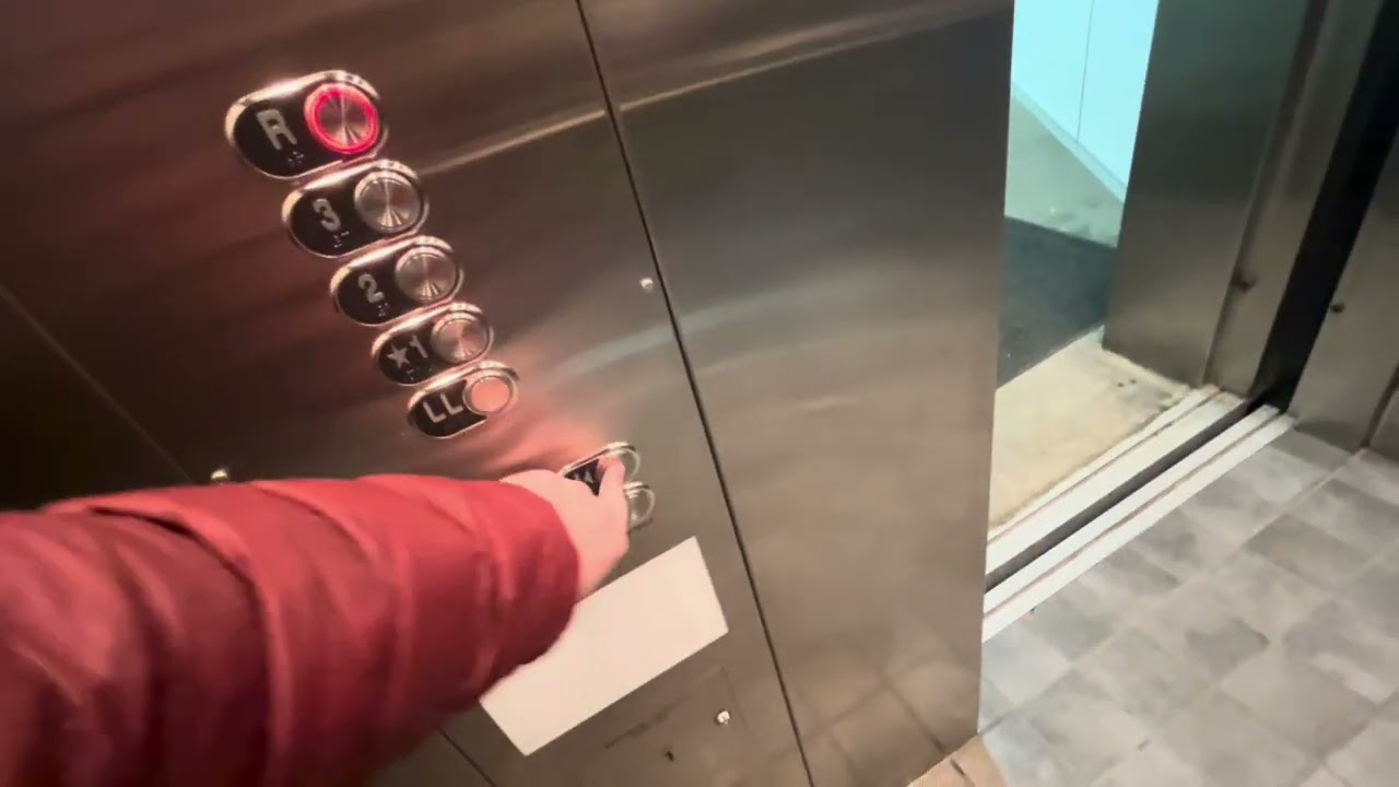 Riding the West Hartford Memorial parking garage elevator ￼with elevator, Cameron ￼