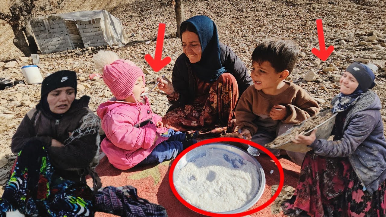 A mother of nomads warms her two little hearts with rice milk in the midst of snow and cold.