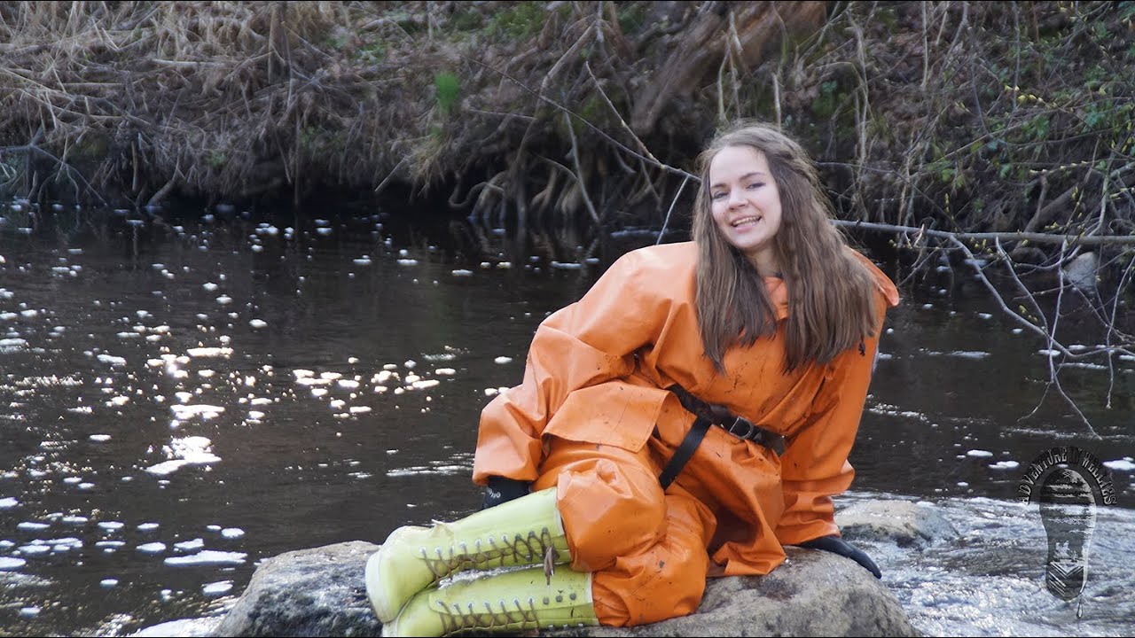 Darina having fun in her wet & muddy orange rainsuit