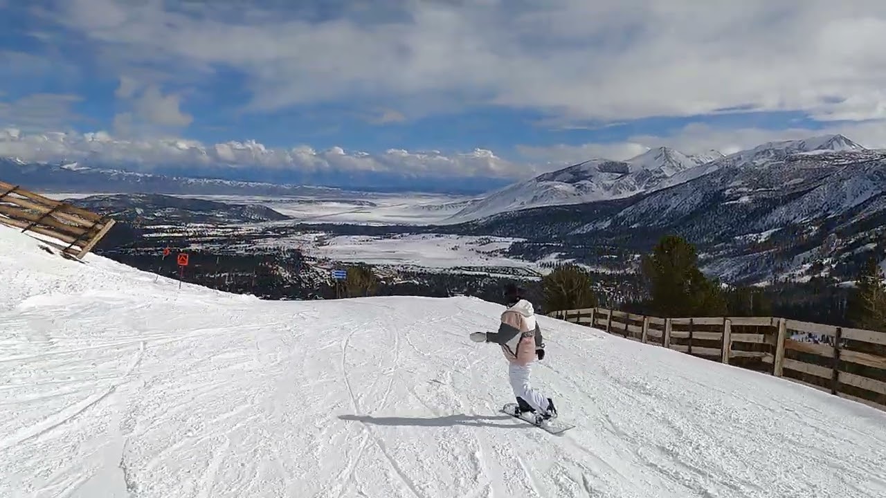 Erica Snowboards Through Trees at Mammoth Mountain.