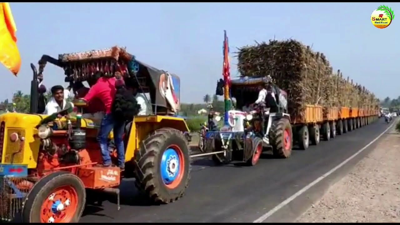 2 industhan tractor 12 trolley ganne se bhari khich rahe|