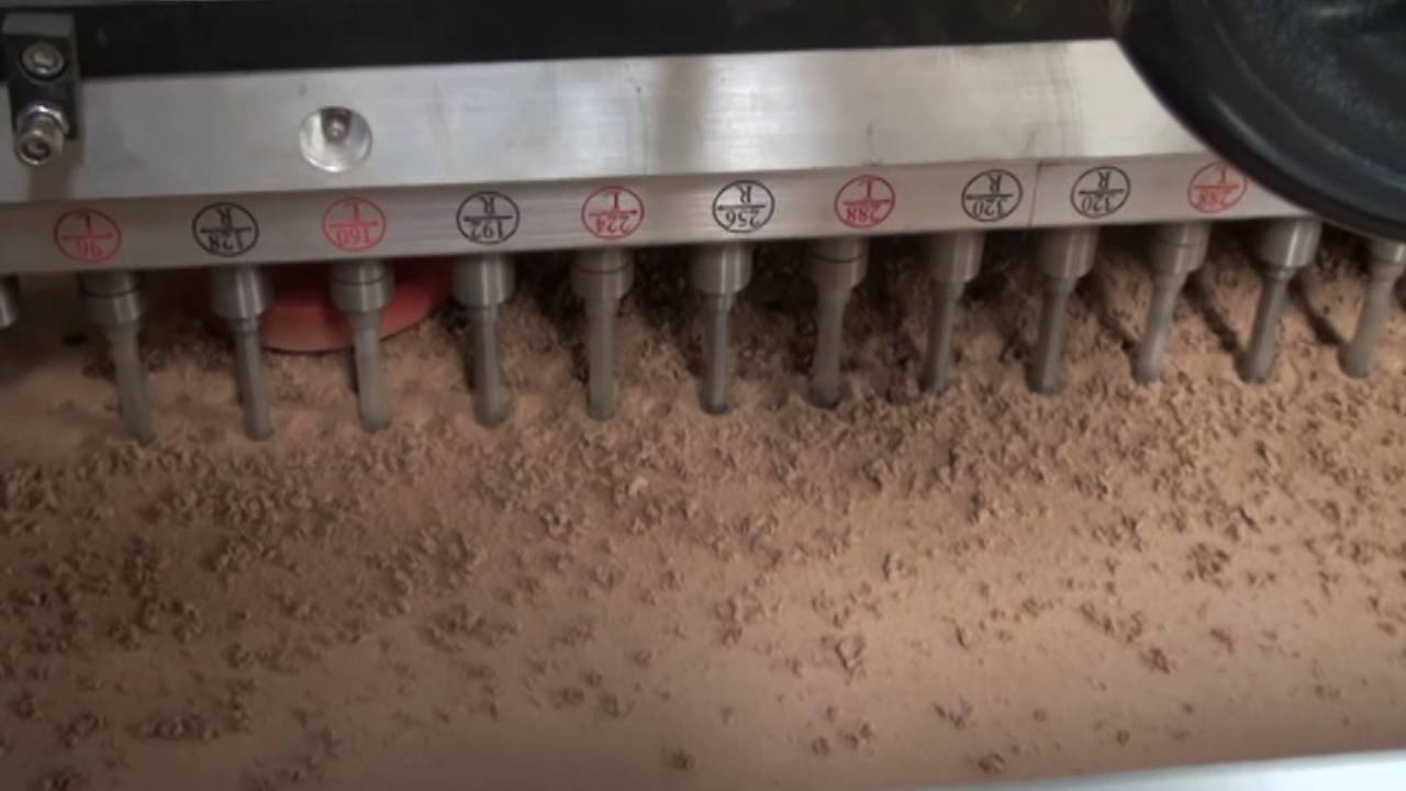 Automatic sound absorbing board drilling machine