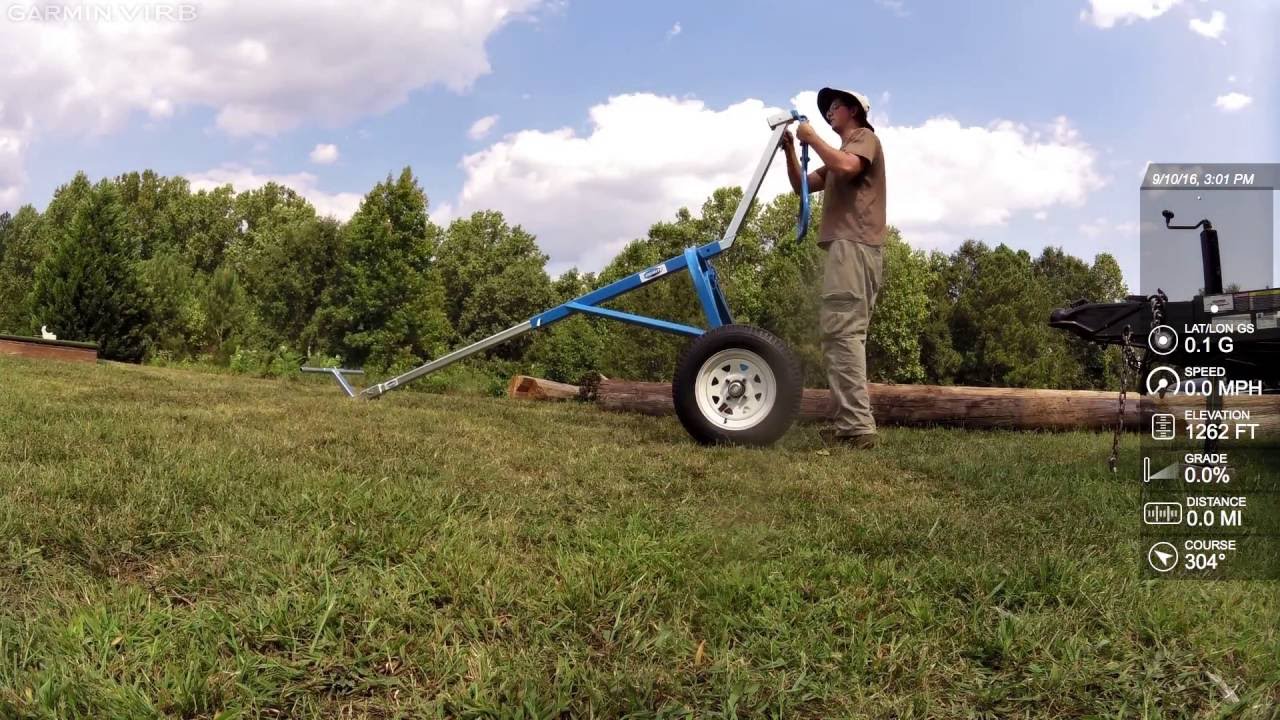 Moving Heavy Logs: Logrite Buck Arch unloading Telephone Poles