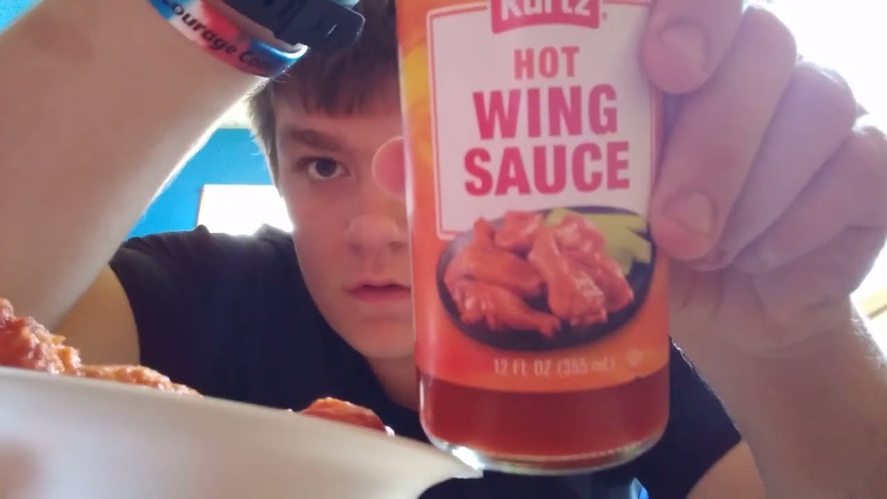 Eating TGI FRIDAYS CHICKEN WINGS WITH KURTS HOT WING SAUCE