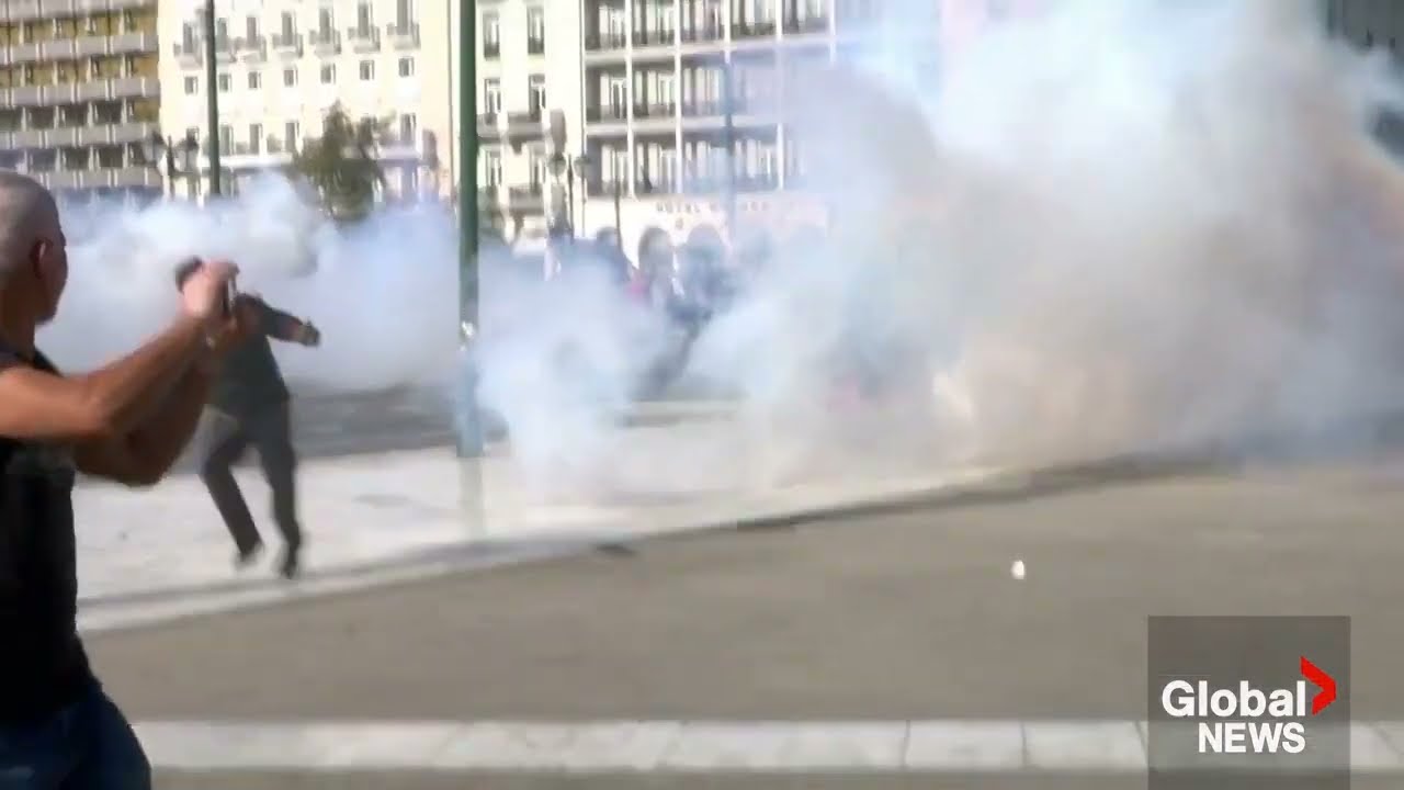 Greece protests Petrol bombs hurled at police during workers' rally in Athens