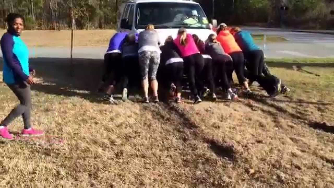 Stroller Strong Moms Help Two Men Out Of The Mud With Their Muscles