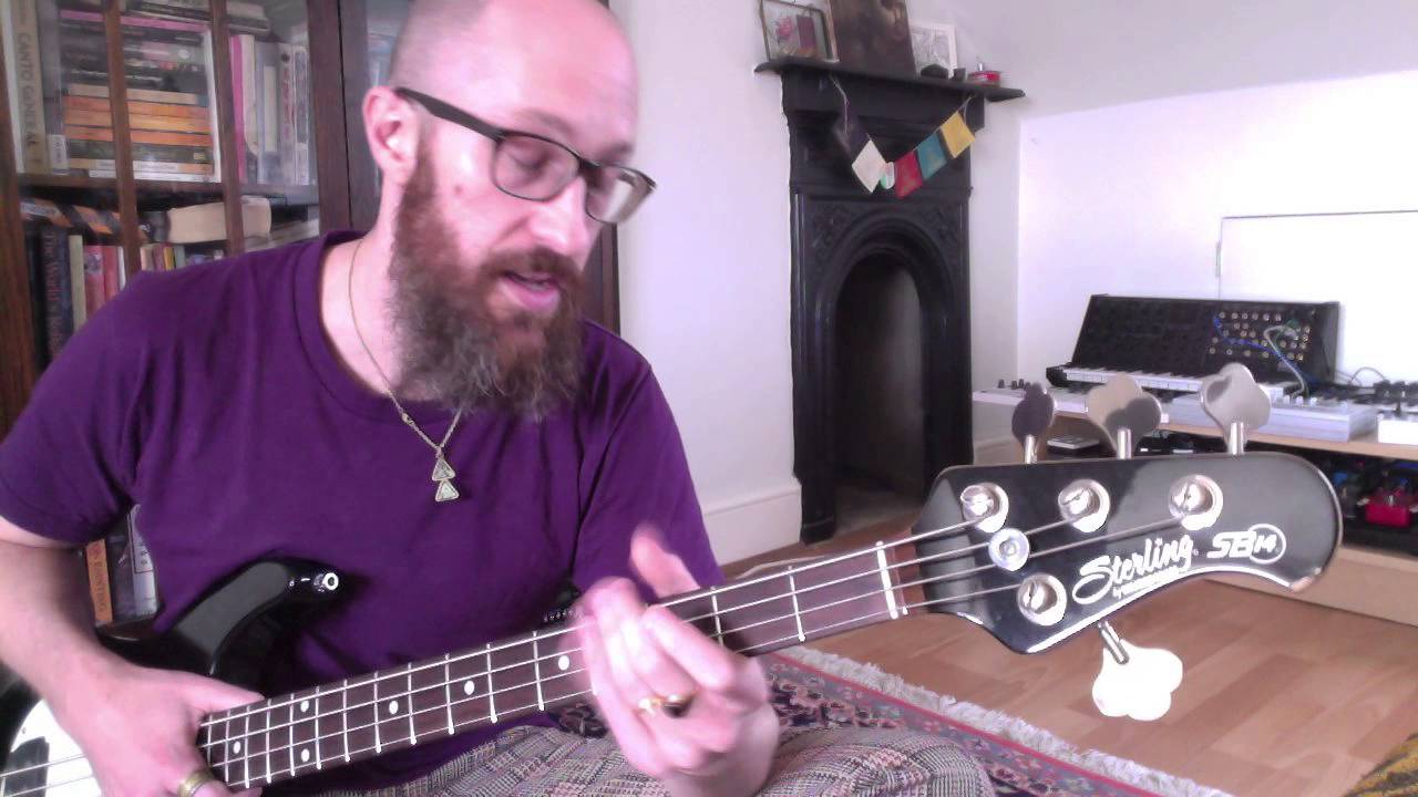 What is bass 'growl' and how does Flea get that growly grind?