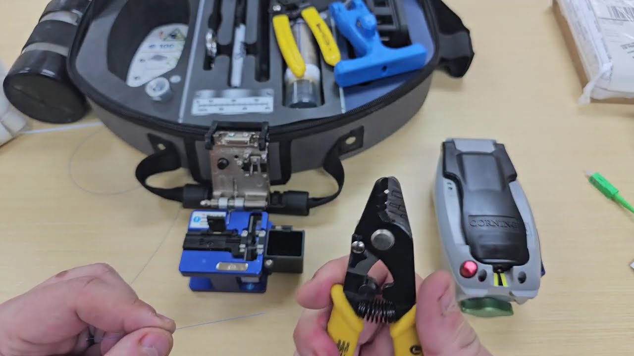 Installing a Corning 250um end on Corning 250um loose tube fiber.