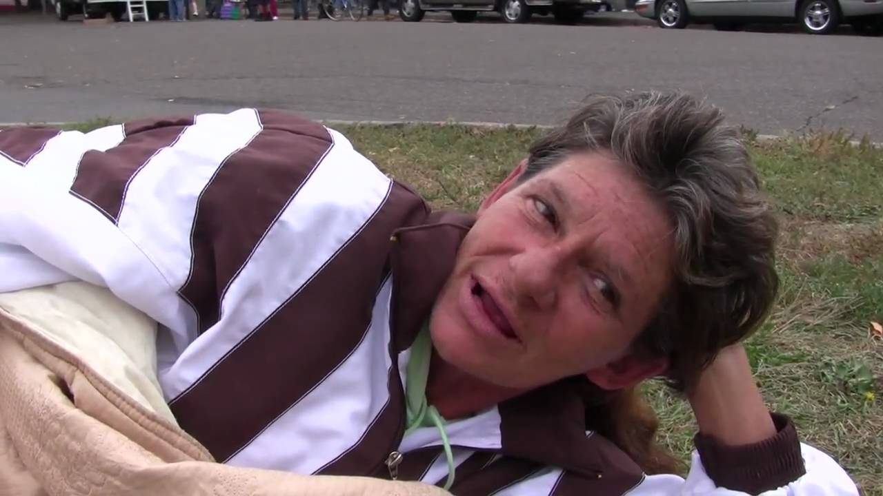 Homeless Woman Sleeping in Front of a Shelter in St. Paul, Minnesota