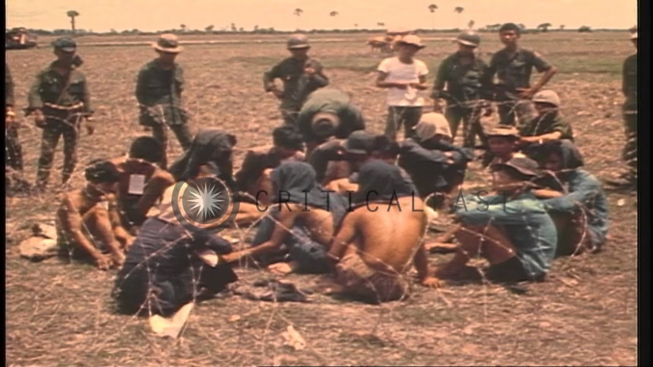 North Vietnamese prisoners are marched to a helicopter by ARVN troops during the ...HD Stock Footage
